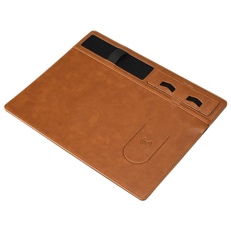 Pink wireless charging mouse pad with integrated mobile phone holder on a desk