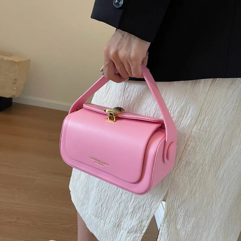 Personalised women's shoulder messenger bag in PU leather, showing letter customisation and stitching detail.