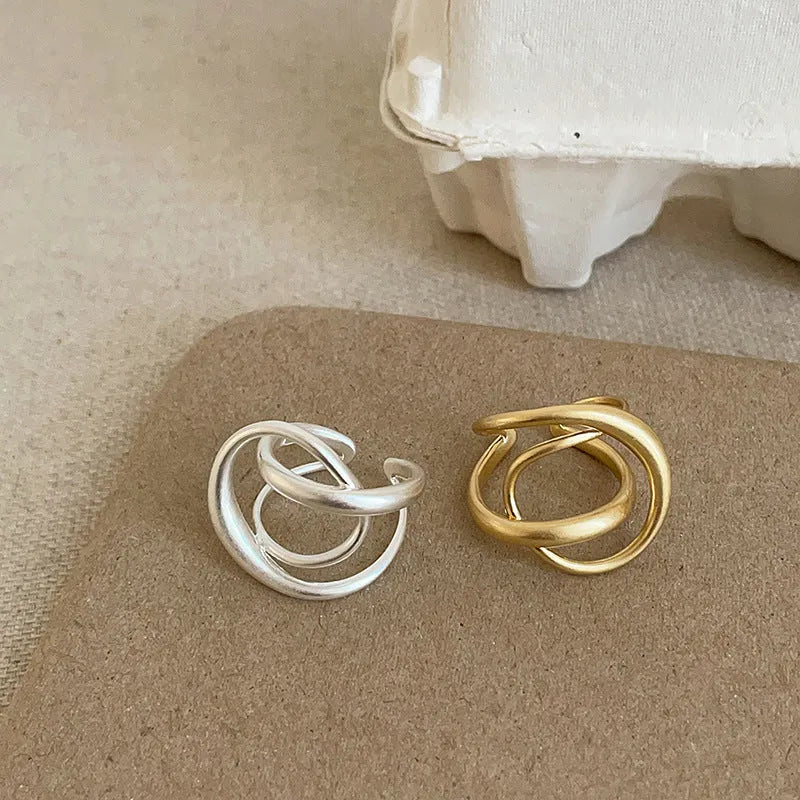 Geometric open ring with three-dimensional interlaced matte metal design