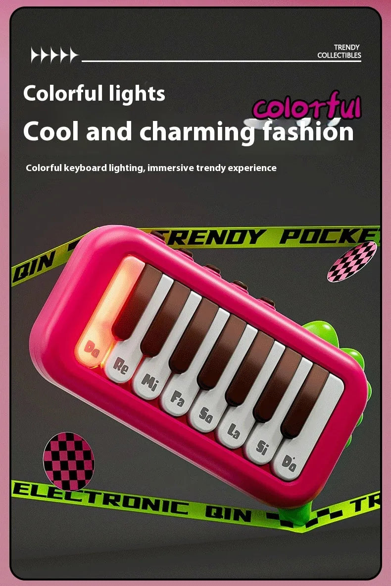 Pocket electronic keyboard little piano pattern toy for children in green and pink plastic.