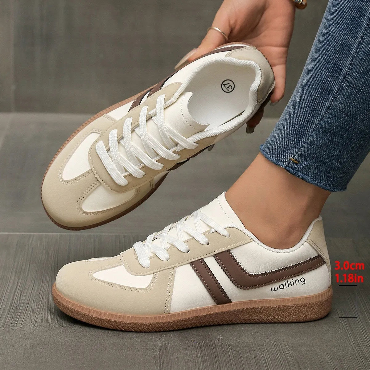 Women's low top casual sneaker in retro style with round toe and lace-up front.