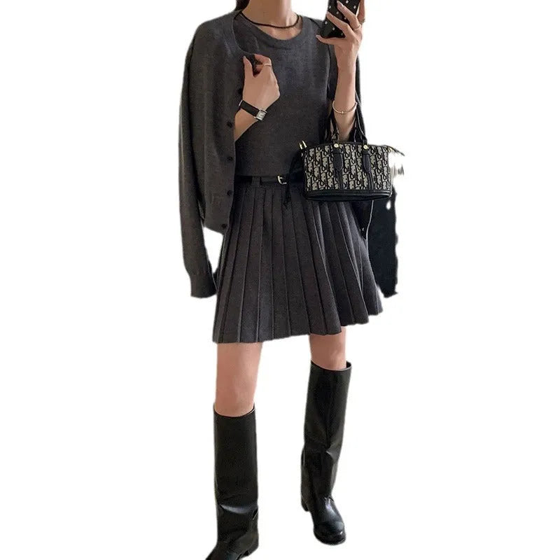 Women's grey art retro knitted two-piece set with pleated vest skirt, belt, and long sleeve cardigan featuring a 3D pattern.