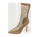 Metallic gold women's high heel sandals with a mesh oversleeve design and pointed stiletto toe.