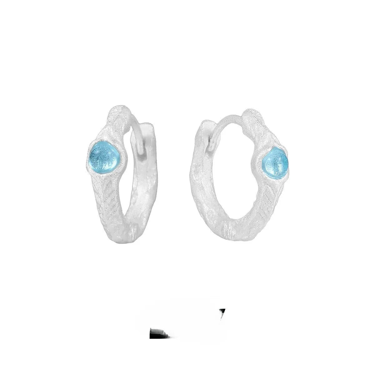 Female geometry round ear clip in burnt silver finish made from 925 silver