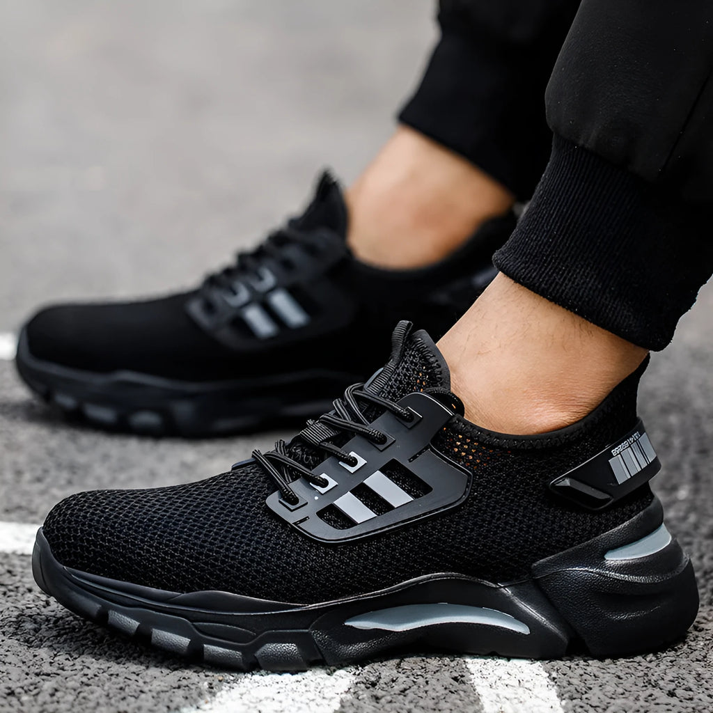 Men's low-top Flyknit work shoes with steel toe cap in black, grey, and yellow colour options.