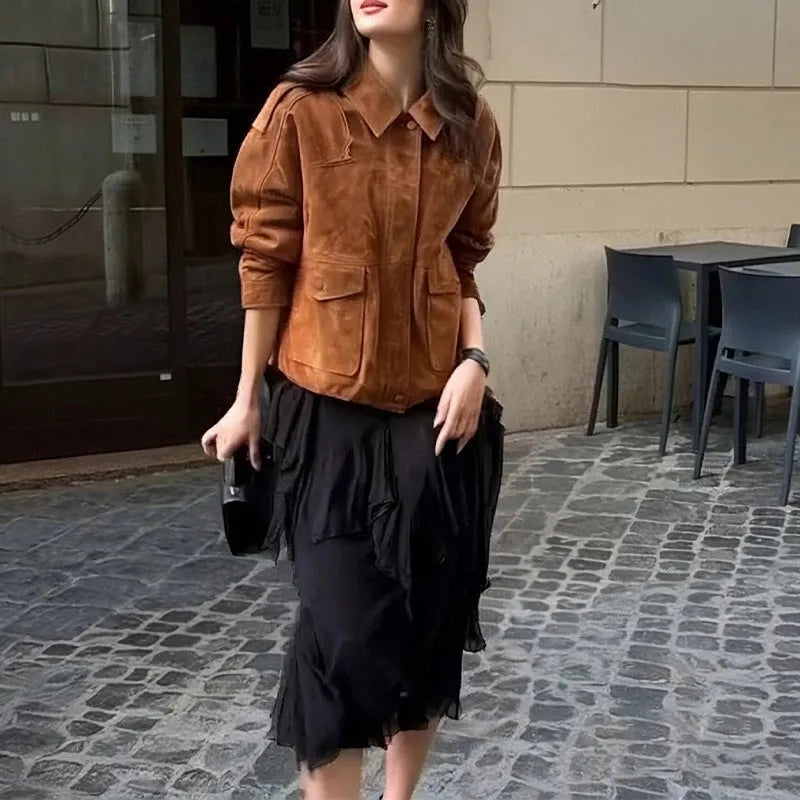 Bright brown women's suede-style polyester coat with regular sleeves on a hanger.