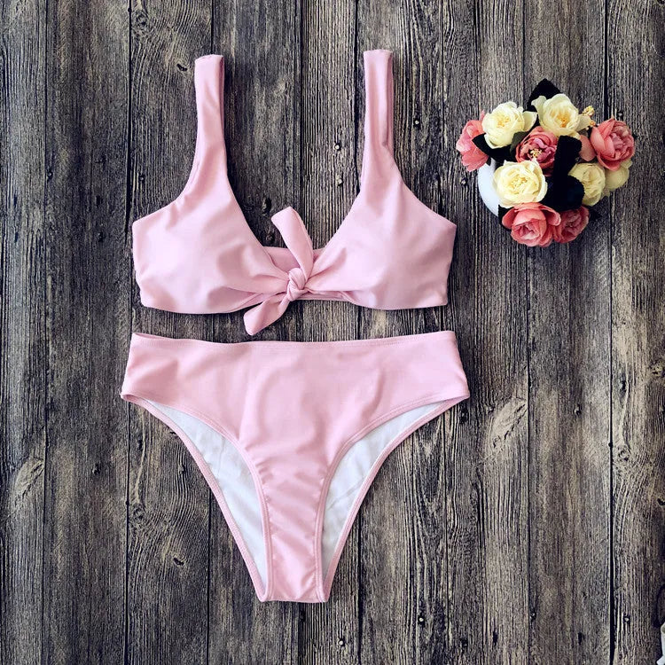 Women's solid colour bikini set in polyester with high-cut briefs, shown in wine red.