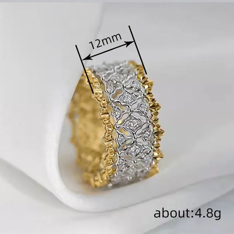Geometric round two-tone gold zircon ring on a copper band.