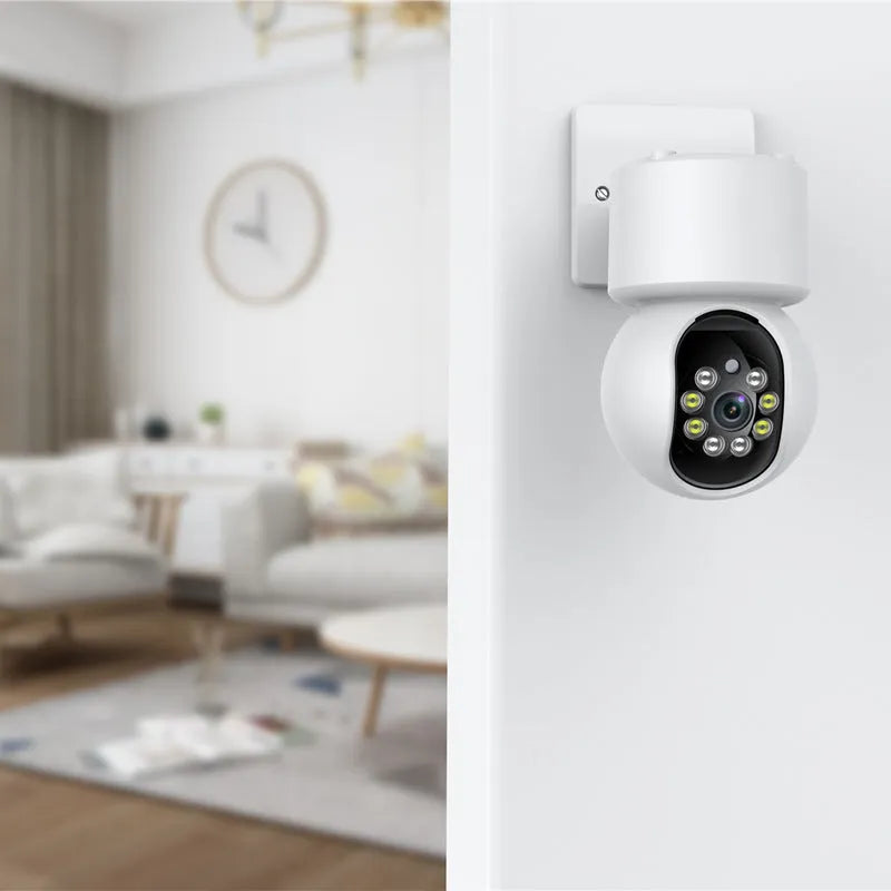 White indoor WiFi security camera with 360-degree rotation capability on stand