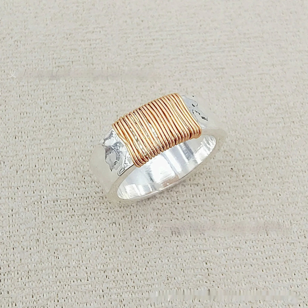 Copper geometric ring with silver golden electroplated finish and irregular vintage coil design.