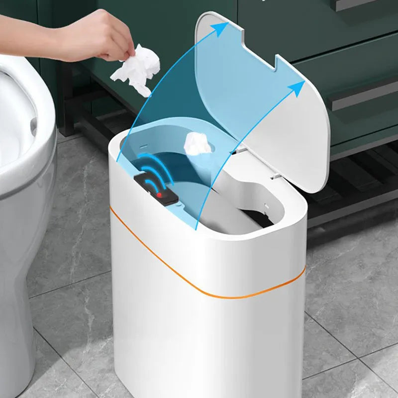 White smart induction trash can with automatic opening lid, shown in a kitchen setting.