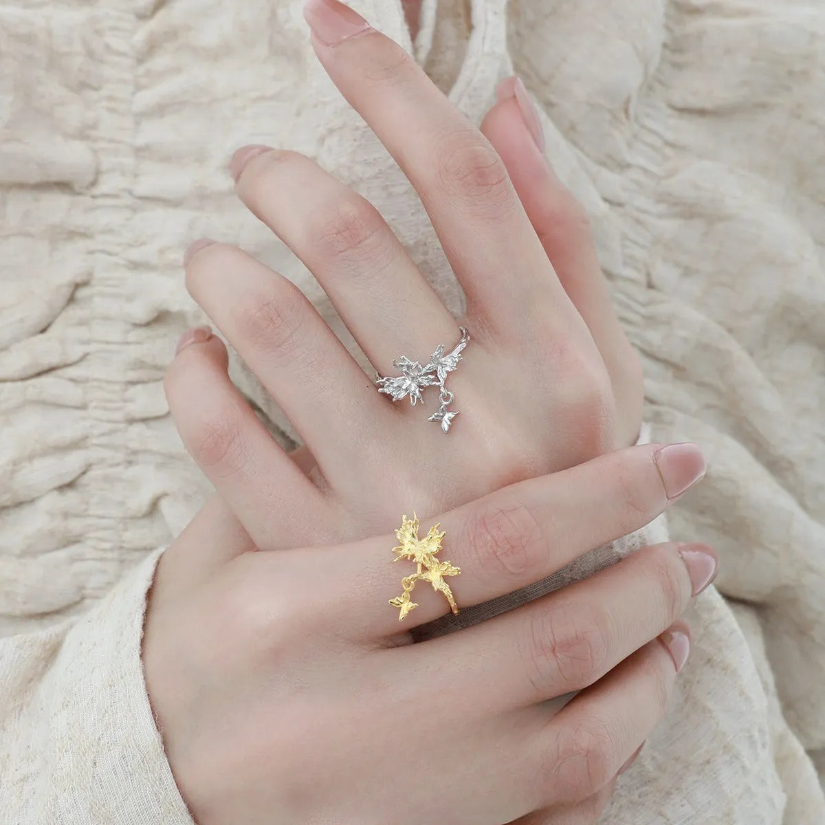 Women's silver butterfly ring with adjustable opening in gold-toned finish