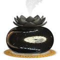 Round pure black lotus aromatherapy ultrasonic humidifier with USB cable.
