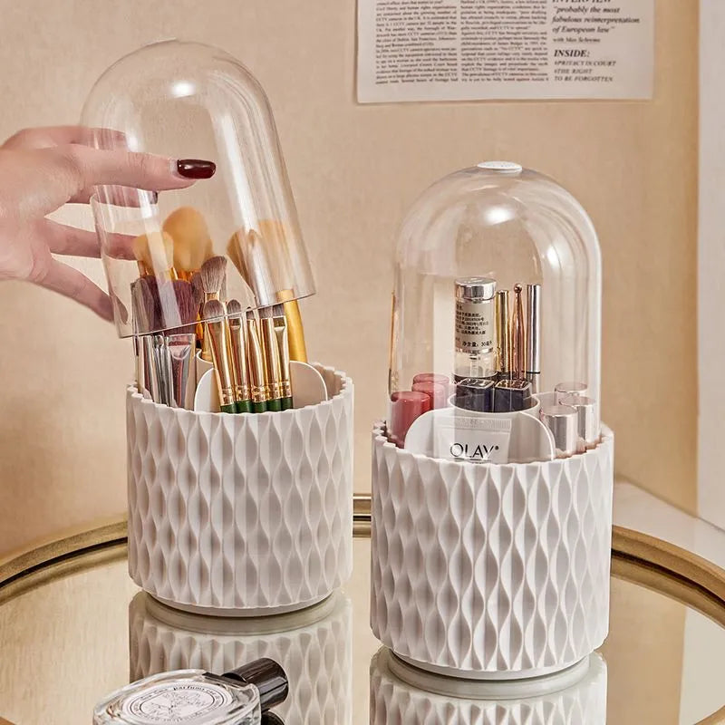 White rotating acrylic makeup brush holder with transparent dust cover on desktop