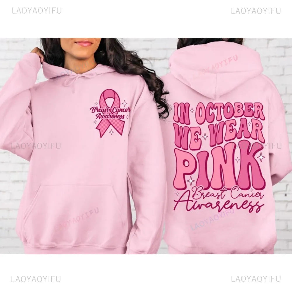 Women's pink pullover hoodie with a retro Breast Cancer Awareness print and side seam pockets.