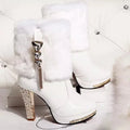 Women's black and white ankle boots with a chunky high heel, shown in solid colour.