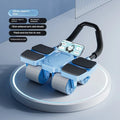 Black abdominal wheel with automatic rebound, four blue wheels, and ergonomic rubber handles on a gym mat.