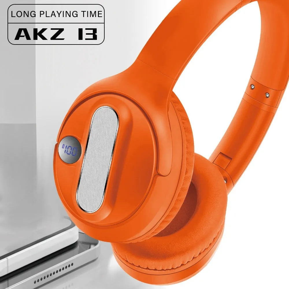 Retro wireless Bluetooth earphones with orange plastic shell, foldable headband, and digital display