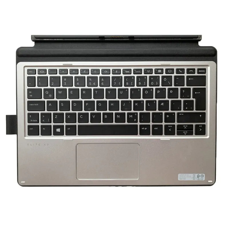 Elite X2 thin portable keyboard with PS/2 cable and wireless dongle on a wooden desk next to a tablet.