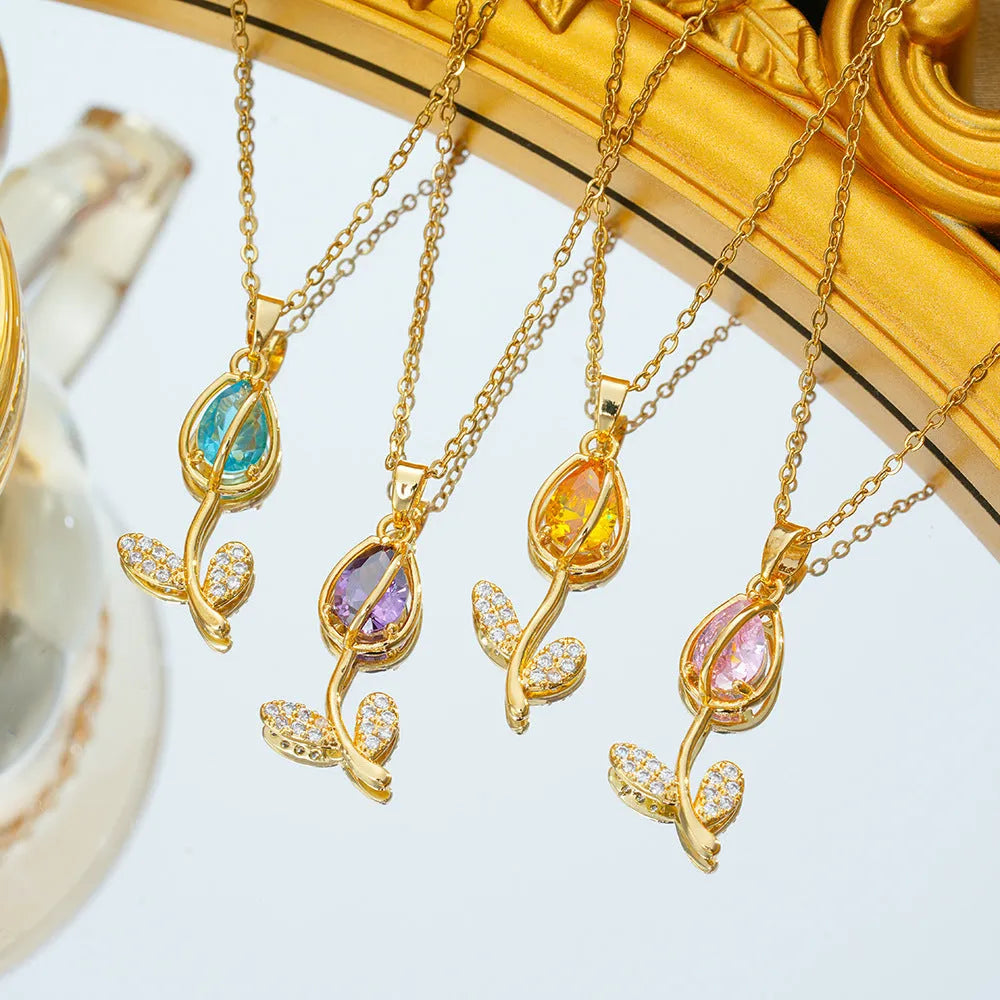 Adjustable gold tulip flower pendant necklace on an O-ring chain, showing colour options.