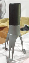 Green and grey automatic cooking mixer device for stirring sauces and soups.
