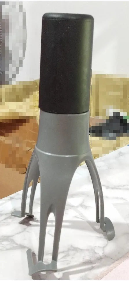Green and grey automatic cooking mixer device for stirring sauces and soups.