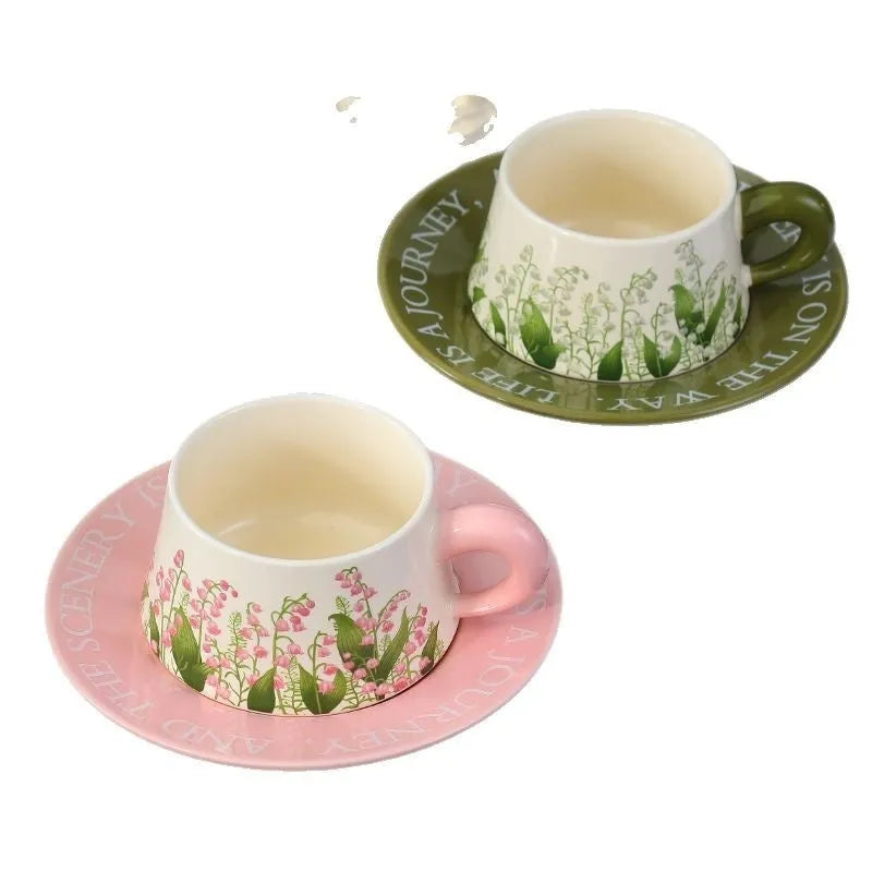 Ceramic coffee cup and saucer set with two mugs, two saucers and two stirring spoons