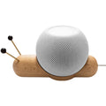 Khaki brown non-slip desktop bracket for holding a HomePod-sized Bluetooth speaker.
