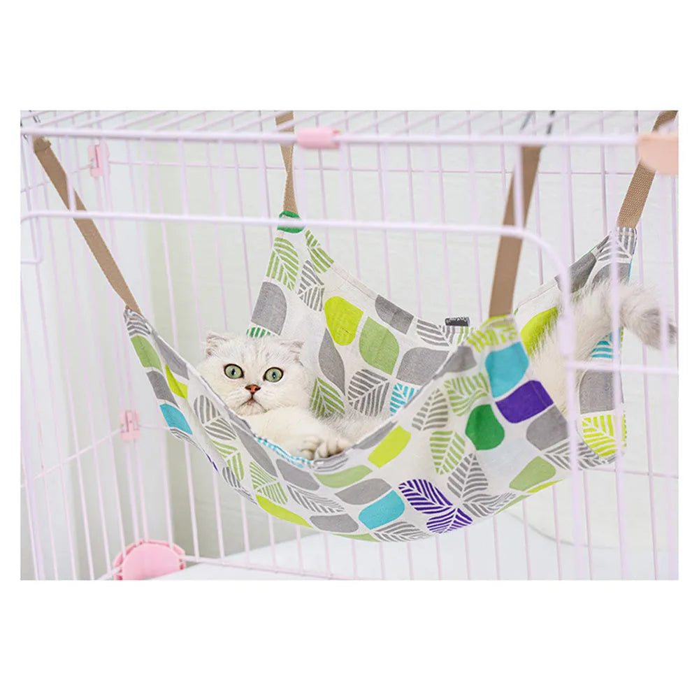 Yellow cotton linen cat hammock with metal hanging hook, shown suspended.