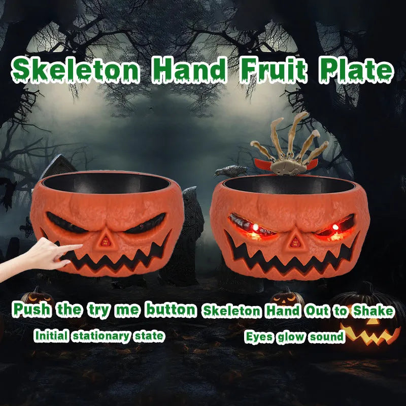 Plastic Halloween pumpkin candy bowl with motion-activated skeleton hand and lighted red eyes