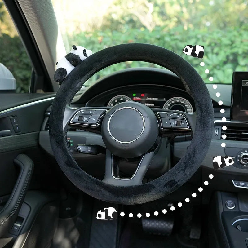Plush black panda design steering wheel cover and matching shoulder pad set for cars.