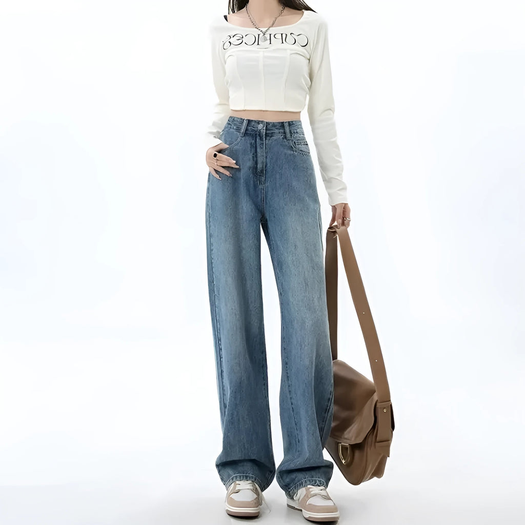 Women's retro blue high-waisted wide-leg denim jeans on a hanger, showing the straight-leg cut.