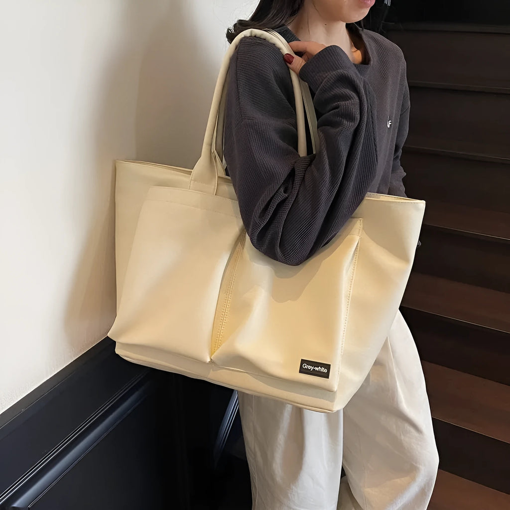 Lightweight PU shoulder bag in black, green, or white with 20-35 litre capacity