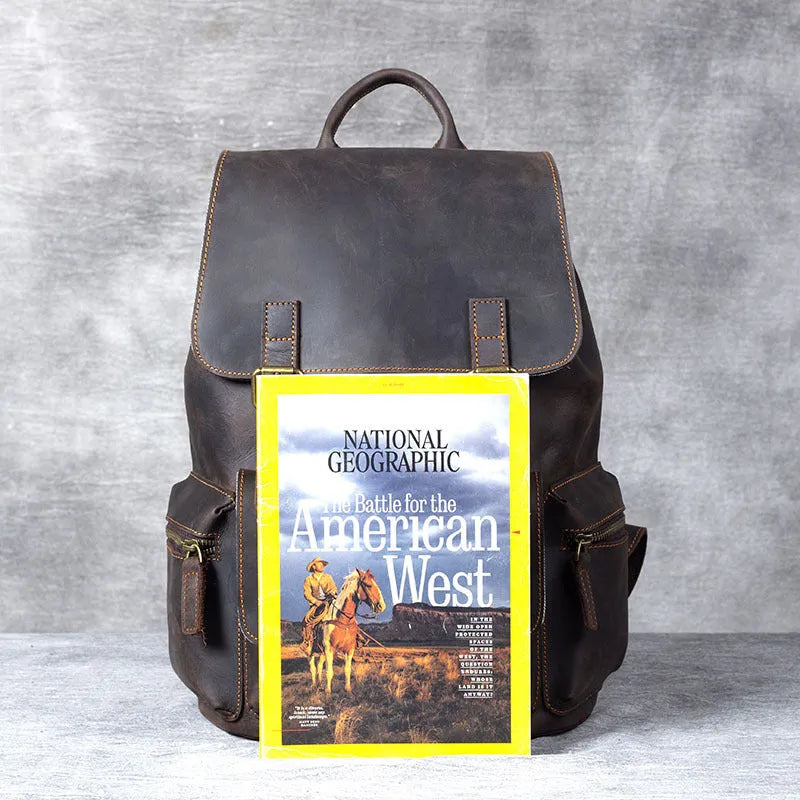 Brown retro-style leather backpack with shoulder straps, made from first layer cowhide with denim lining.