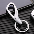 A black zinc alloy double-ring key chain holding a set of keys against a neutral background.