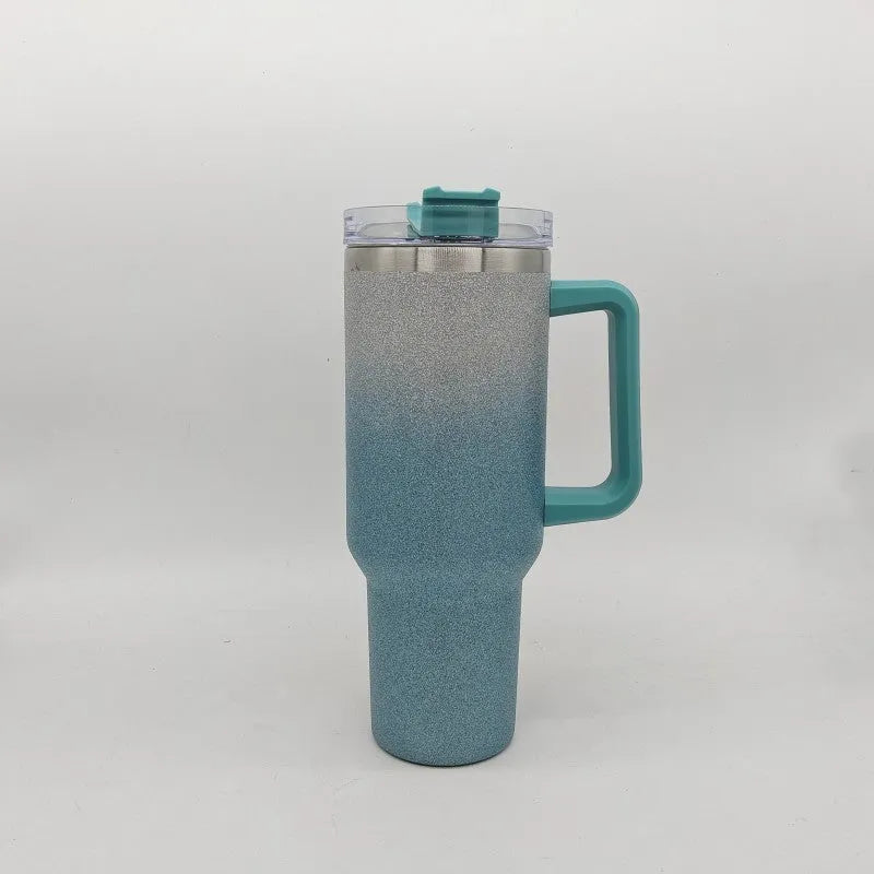 Large stainless steel vacuum insulation cup with gradient colour finish showing thermal retention design