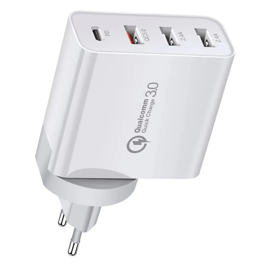 A white multi-port USB fast charger with UK plug and multiple USB-C and USB-A ports on a wooden table.