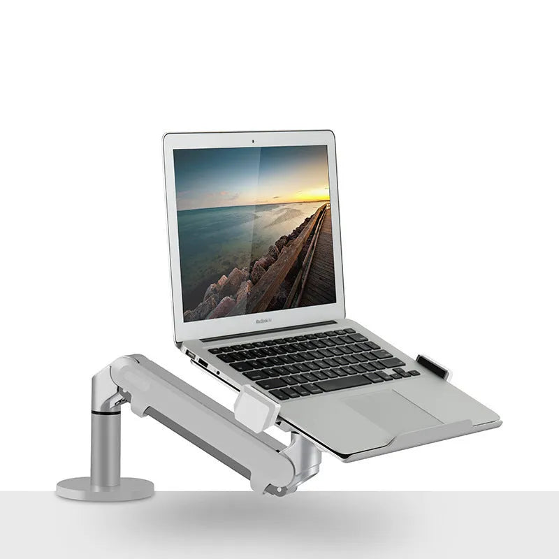 Silver aluminium alloy hover notebook stand on a desk holding a laptop.