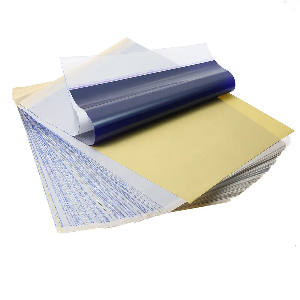 A4 tattoo transfer paper sheets with clear guide lines and a tube of transfer paste gel.