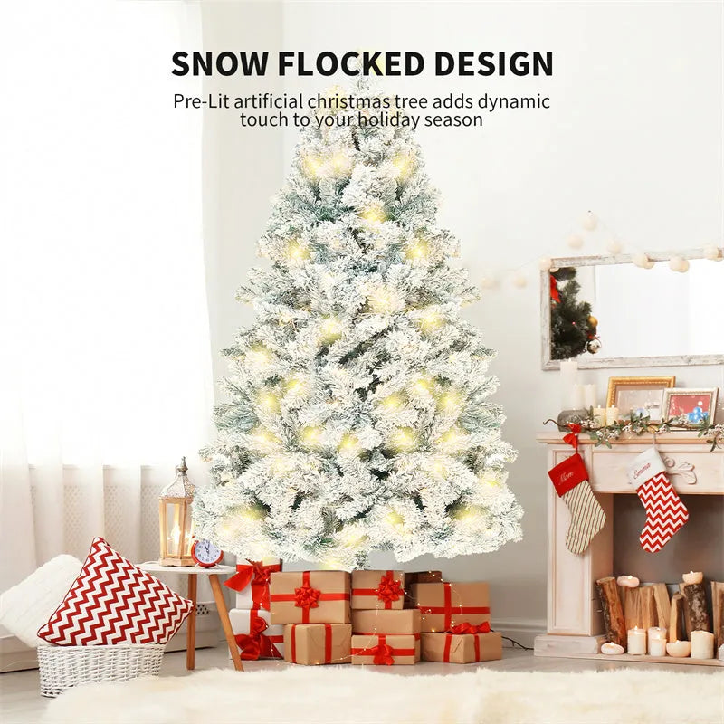 Green and white snow-dusted artificial PVC Christmas tree on a metal stand.