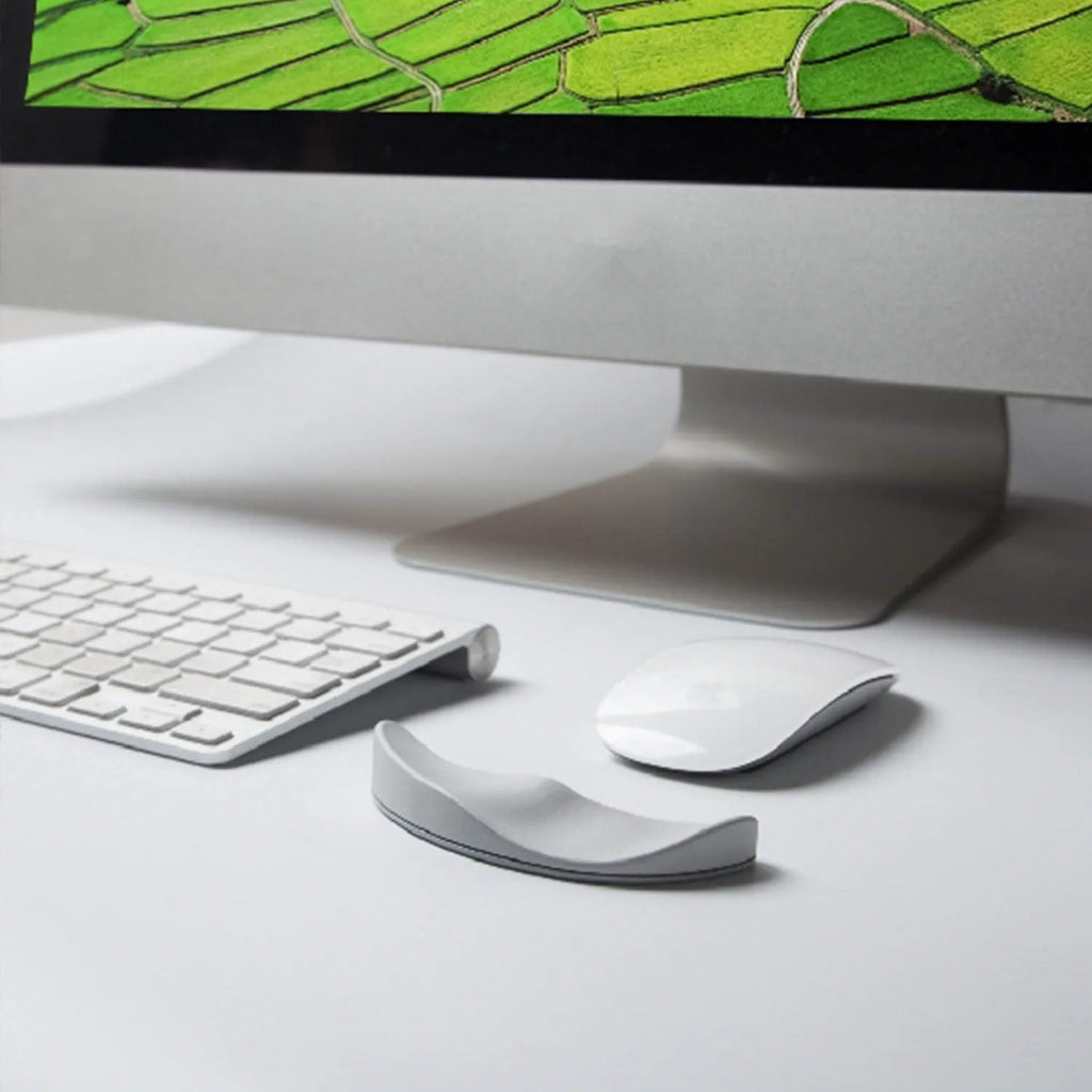 Ergonomic silicone gliding mouse wrist rest for right-handed use, black, 10 x 4.5 x 5 cm, on desk with computer mouse