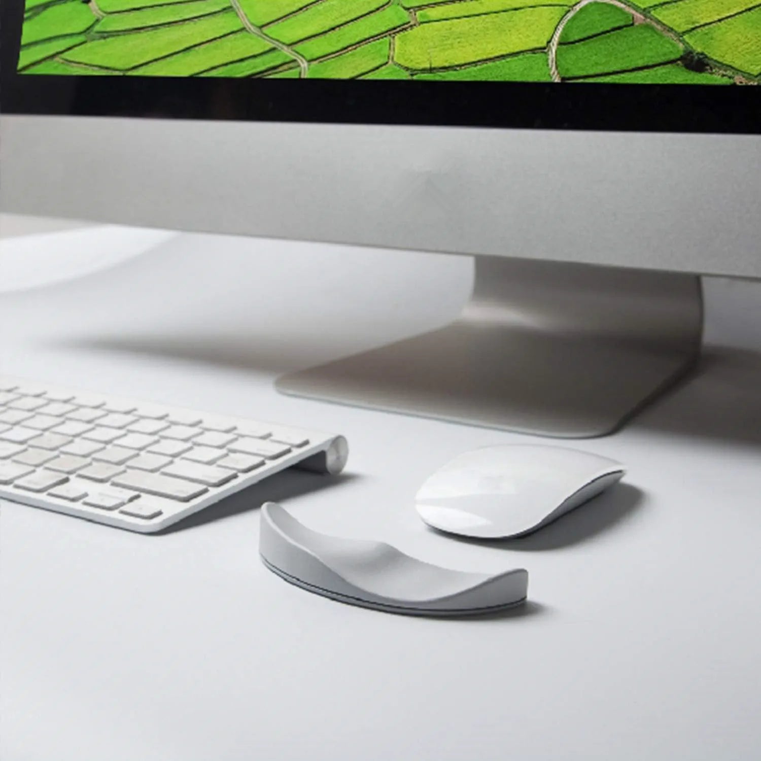 Ergonomic silicone gliding mouse wrist rest for right-handed use, black, 10 x 4.5 x 5 cm, on desk with computer mouse