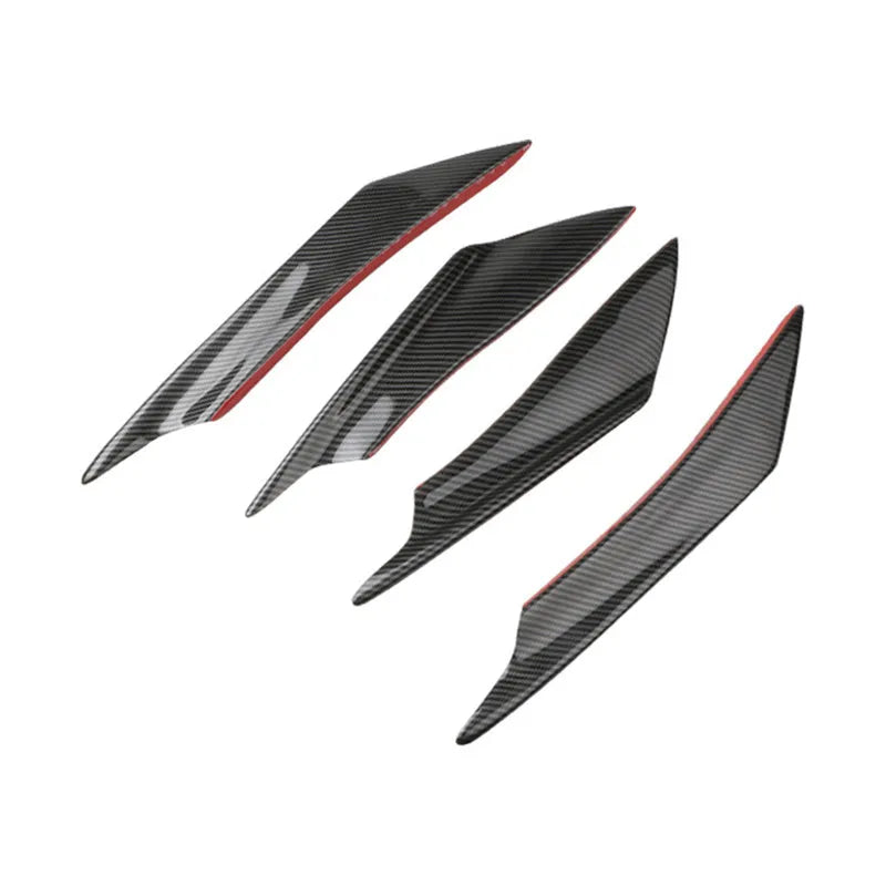 Set of four carbon fibre effect ABS plastic bumper spoiler blades for car modification.
