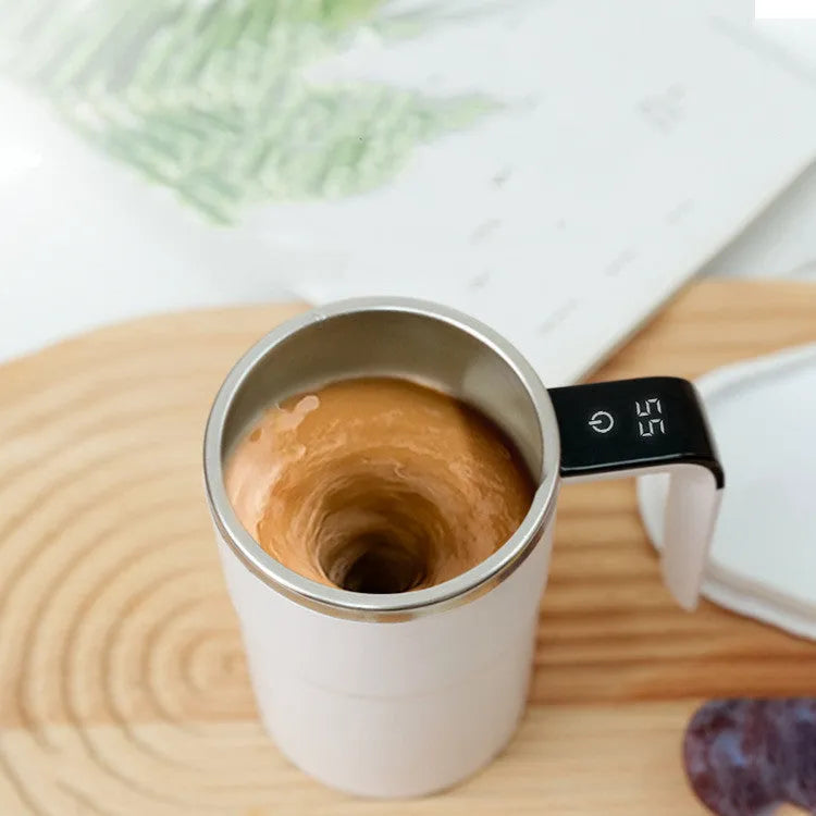White automatic magnetic stirring mug with LCD display showing temperature reading