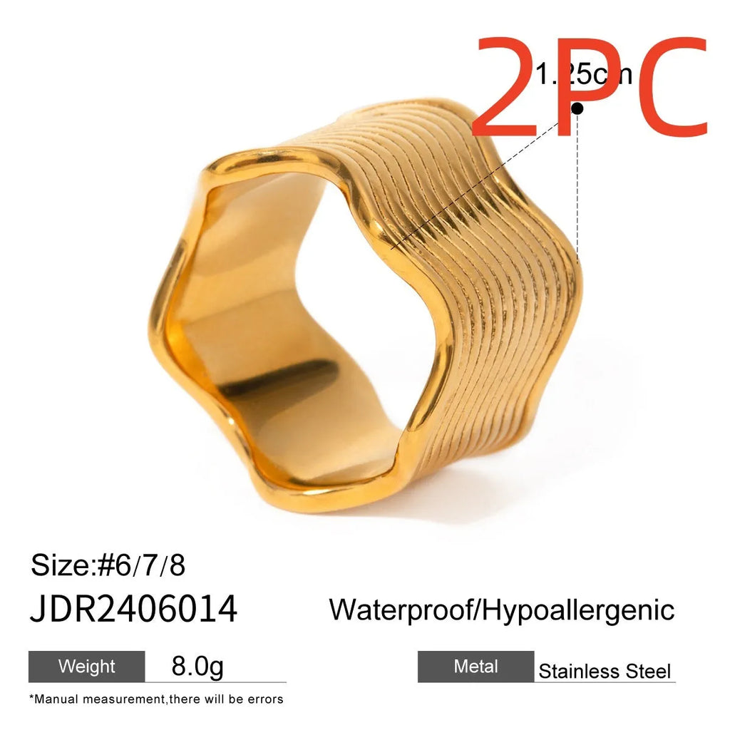 Stainless steel wide band ring with geometric wave pattern and polished electroplated finish