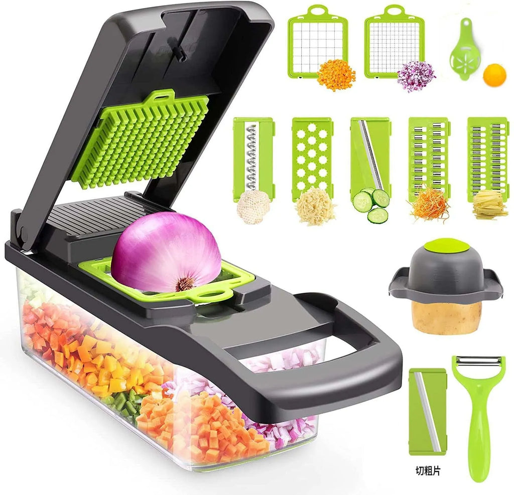 Grey stainless steel vegetable cutter with multiple blades and accessories on kitchen work surface