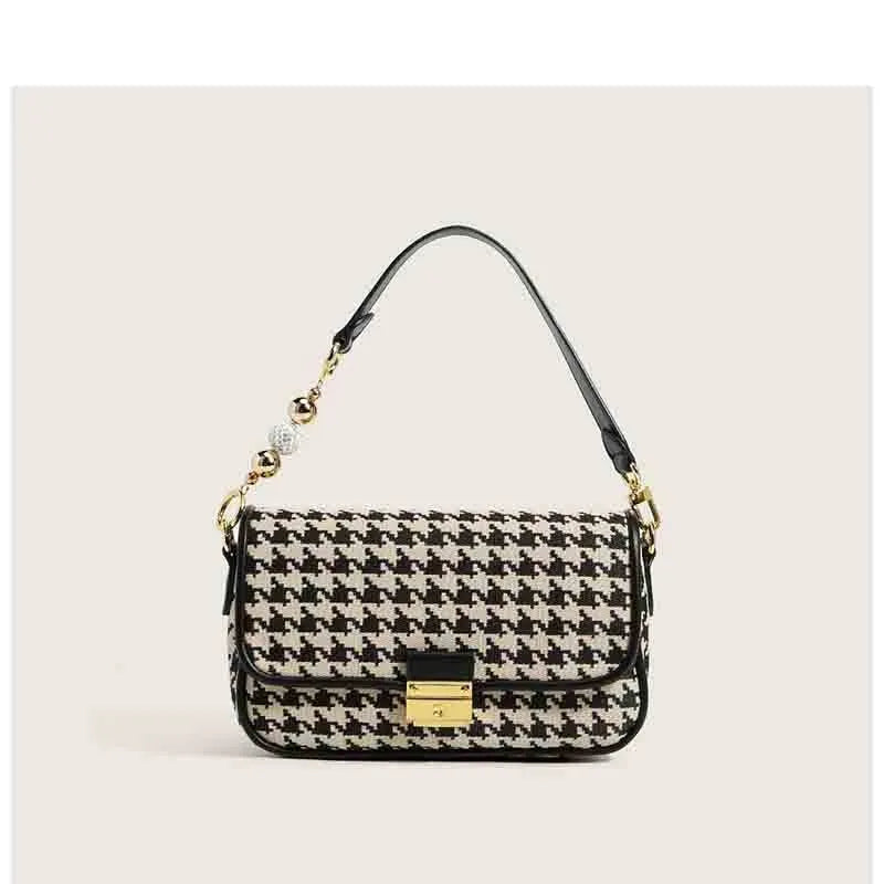 Houndstooth plaid shoulder bag with embossed texture, 23 x 7 x 14 cm, showing slit pocket and picture colour.