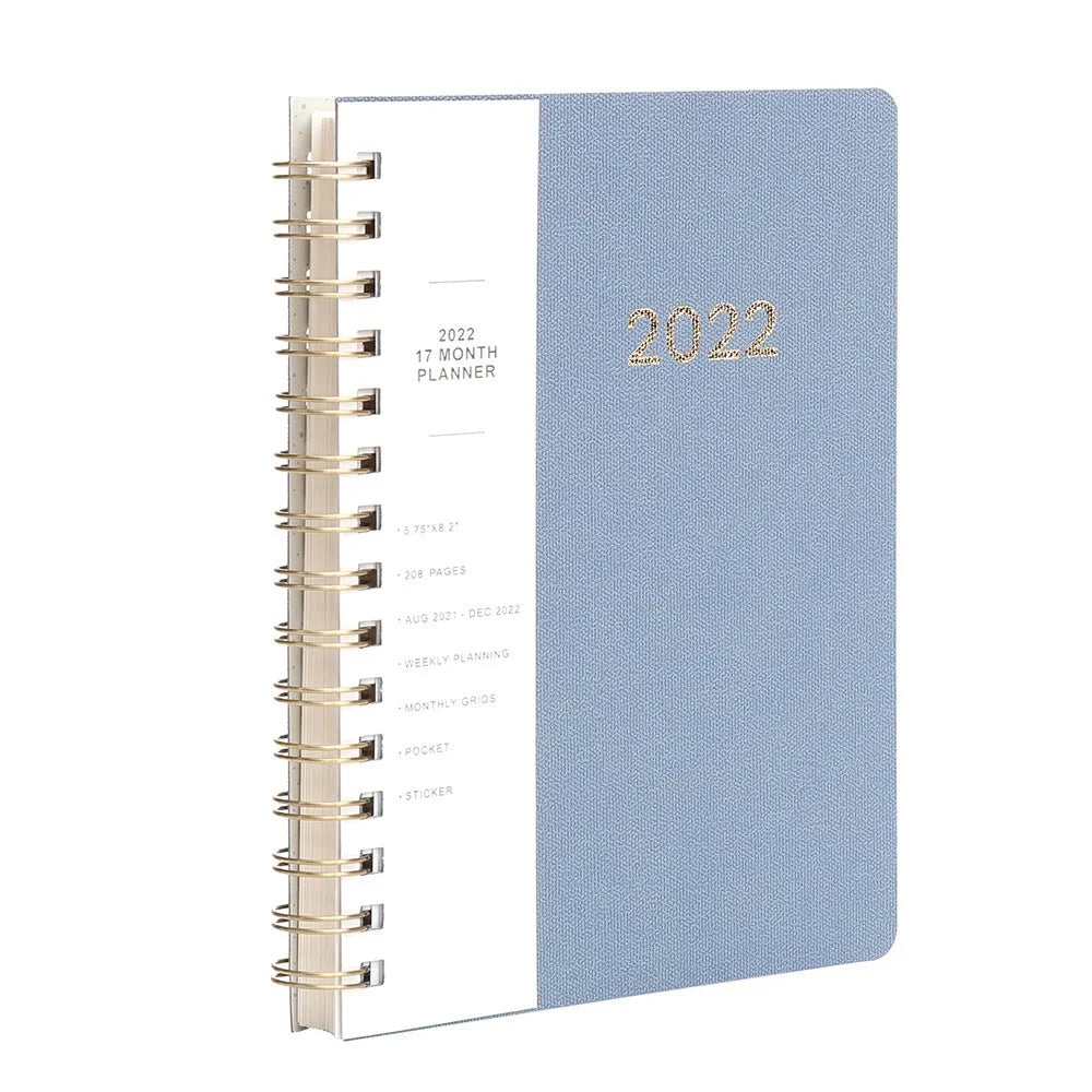 Blue or green PU leather student plan notebook with coil binding showing 2022 week planner pages and interior pockets