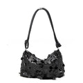 Soft polyester women's underarm crossbody bag in black, showing sandwich pocket design and single strap.