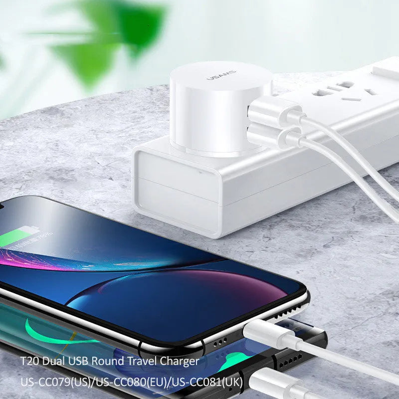 White portable universal dual USB phone charger with US, EU, and UK plug heads